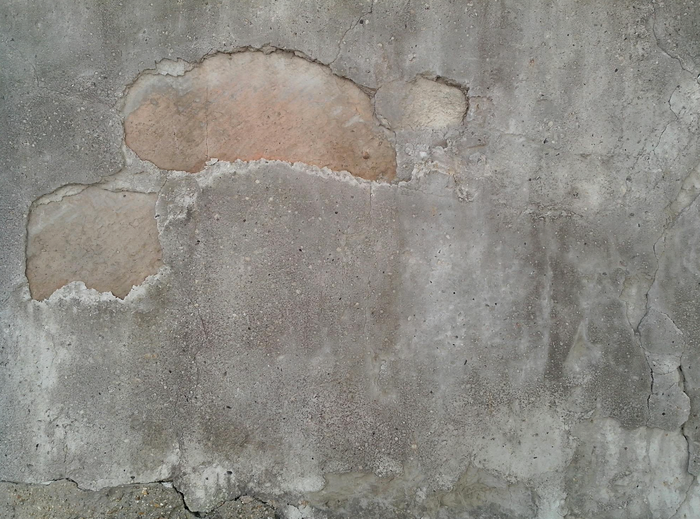 Aged worn concrete surface showing deterioration